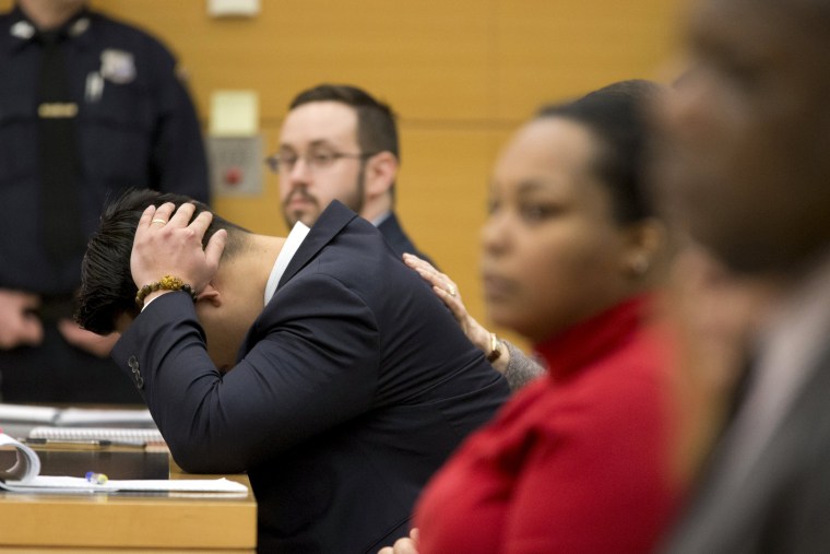 Image: New York City Police officer (NYPD) Peter Liang is lead from the court room at the Brooklyn Supreme court in the Brooklyn borough of New York