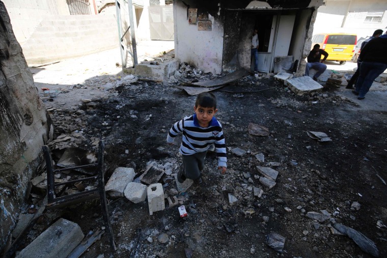 IMAGE: Palestinian boy in Qalandia debris