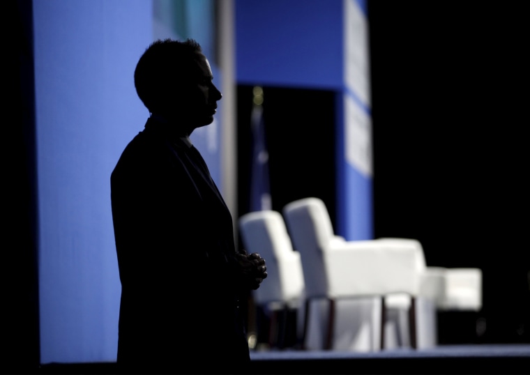 Image: A U.S. Secret Service officer stands beside the stage