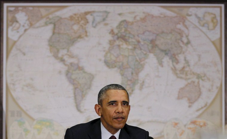 Image: U.S. President Barack Obama attends a meeting with the National Security Council at the State Department in Washington