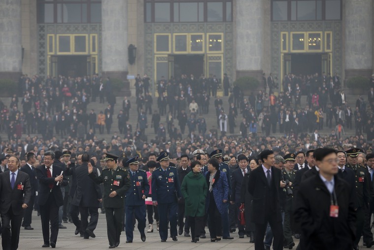 Delegates leave the Great Hall of the People after attending a session ahead of Saturday's opening of China's National People's Congress (NPC) in Beijing. The political conclave comes as China's leaders are being tested by new challenges, including an economy that has slowed to a 25-year low, global uncertainty over the country's tumultuous stock markets and currency movements, and tensions over the South China Sea.