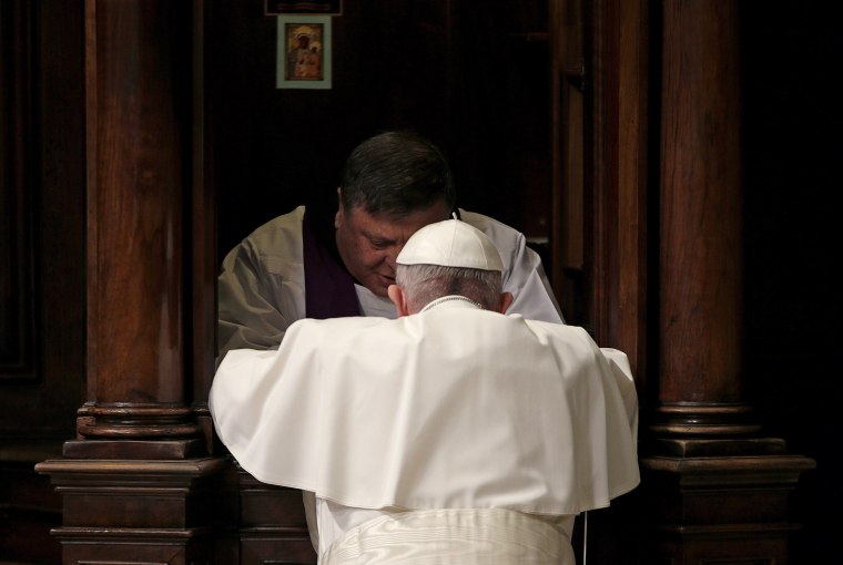 Pope Francis confesses as he leads a penitential service in Saint Peter's Basilica at the Vatican.