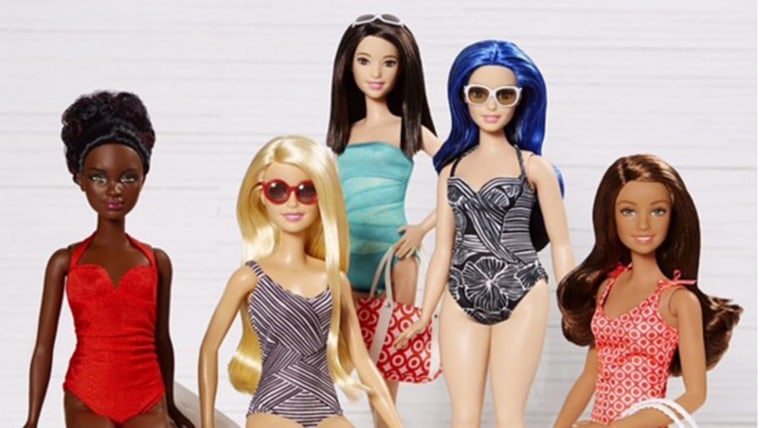 Barbies show off new swimsuits from Target.