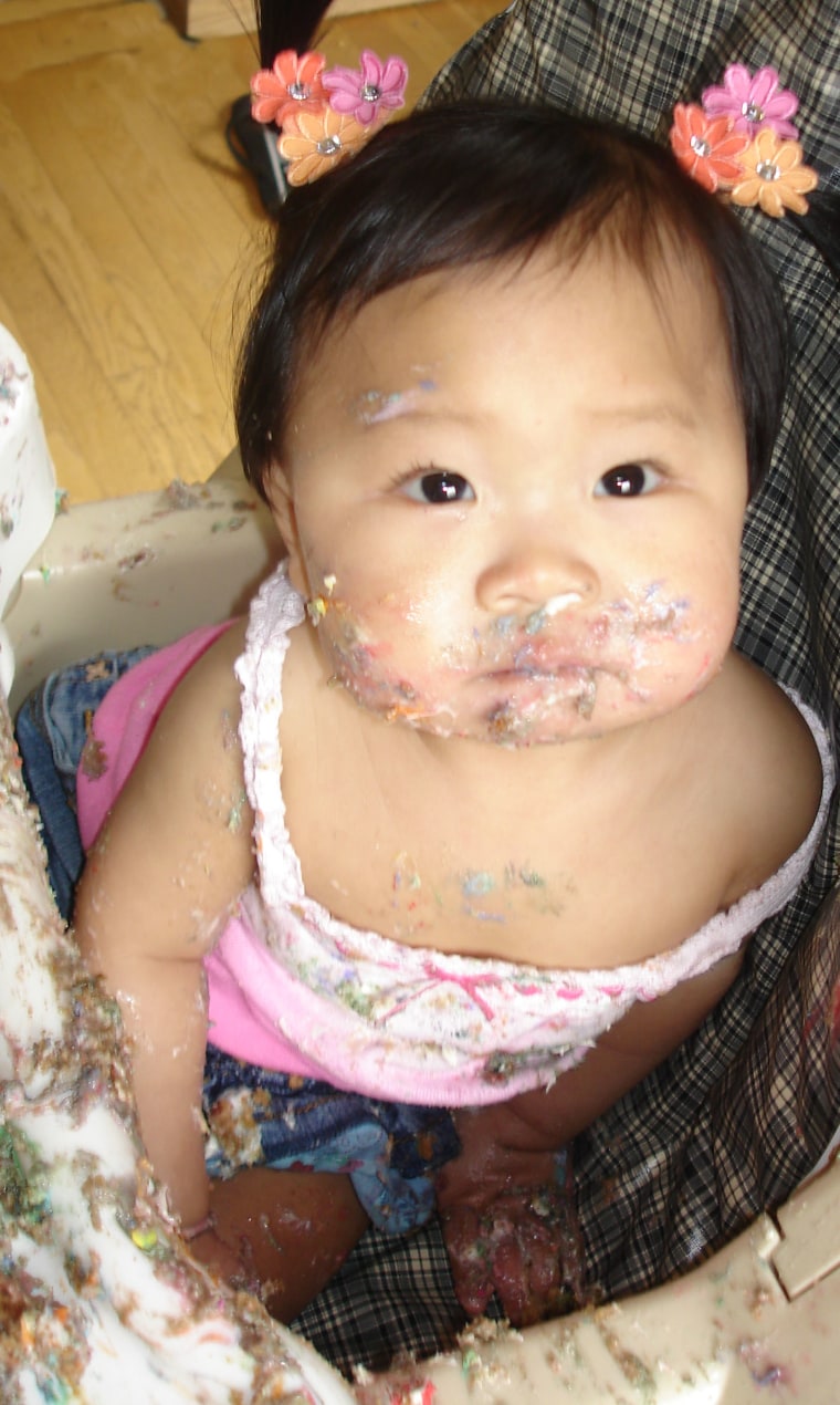 Happy birthday to us! Now, let's all go eat cake and enjoy it as much as TODAY Parenting Team member Leslie Oh's daughter at her first birthday.
