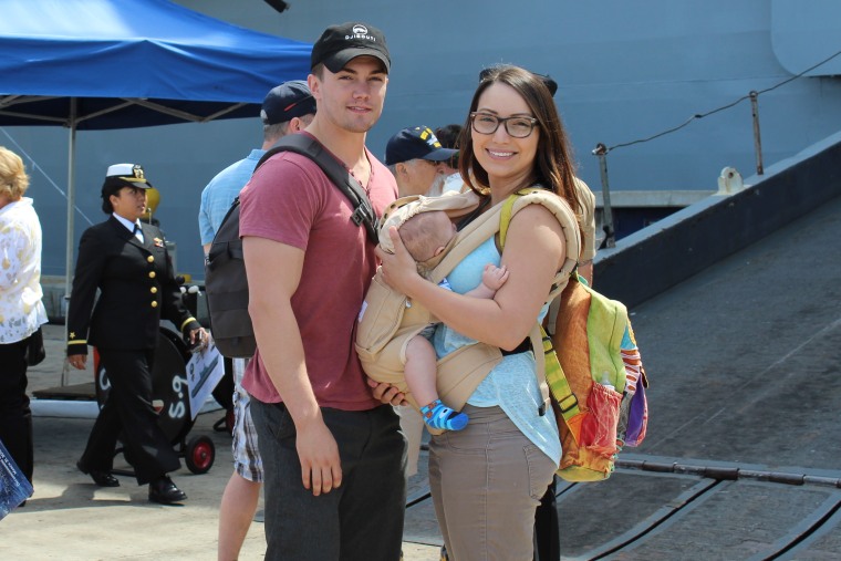 Valentina Caceres poses with her husband Andrew Simich and their 15-month-old son Maverick Simich. He encouraged her to go to Greece and volunteer.