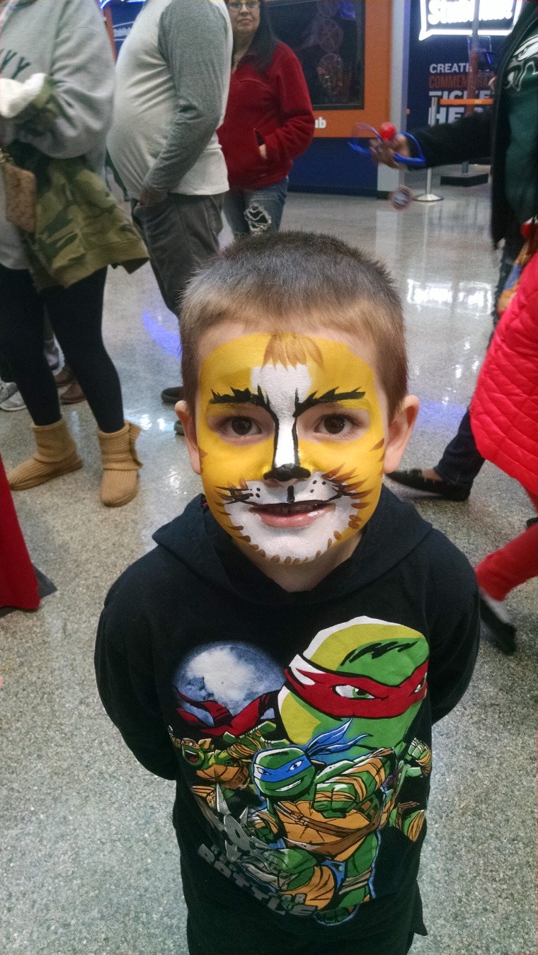 Max with his face painted at the circus.