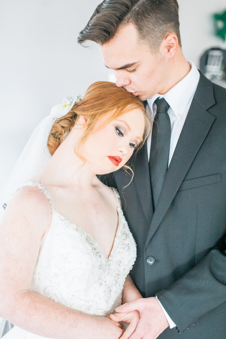 Model with Down syndrome poses for wedding photo shoot