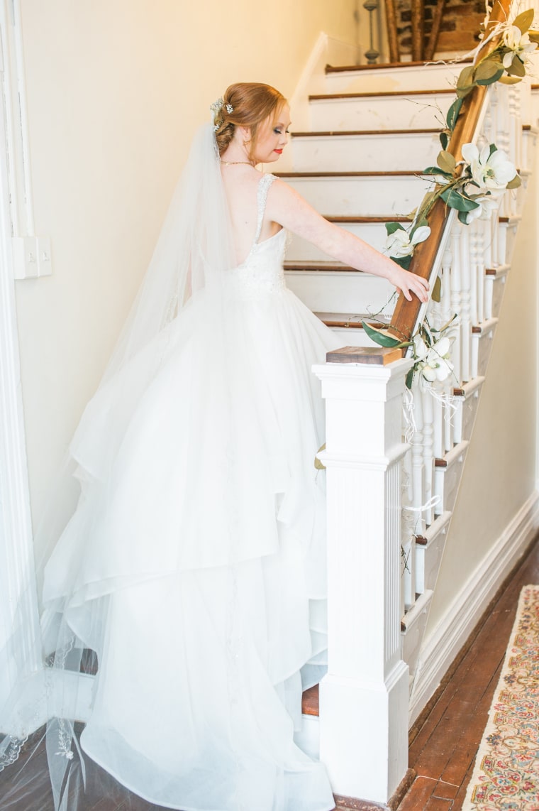 Model with Down syndrome poses for wedding photo shoot