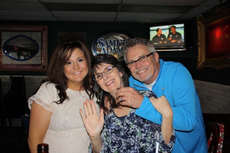 Nickalena pictured with her mother and father