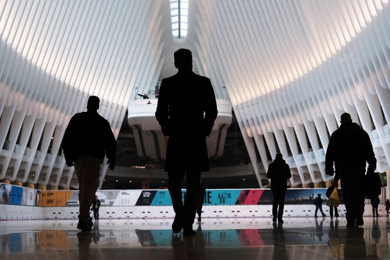 Image: Commuters walk through the Oculus of the partially opened World Trade Center Transportation Hub