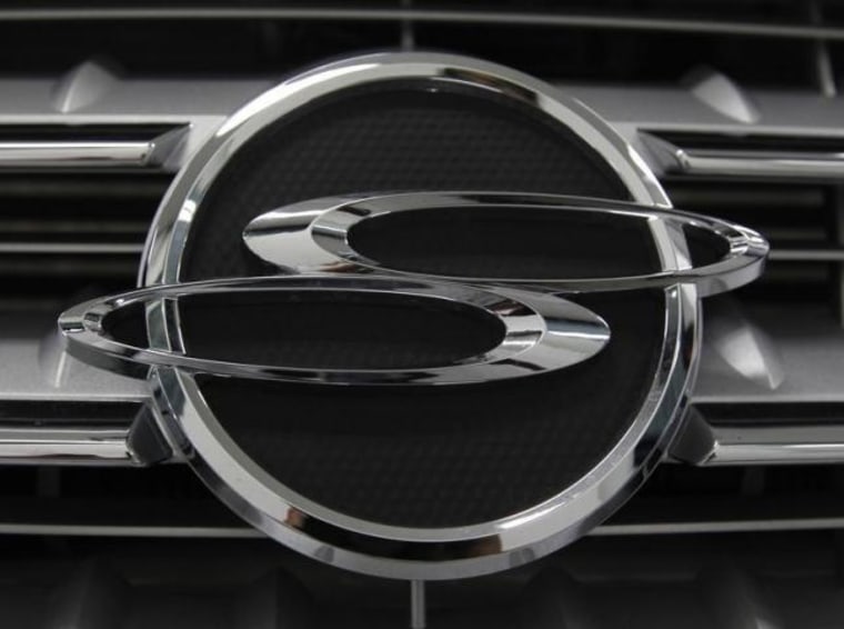 A logo of Ssangyong Motor is seen on the automaker's sport utility vehicle 'Kyron' displayed for customers at the company's branch shop in Seoul