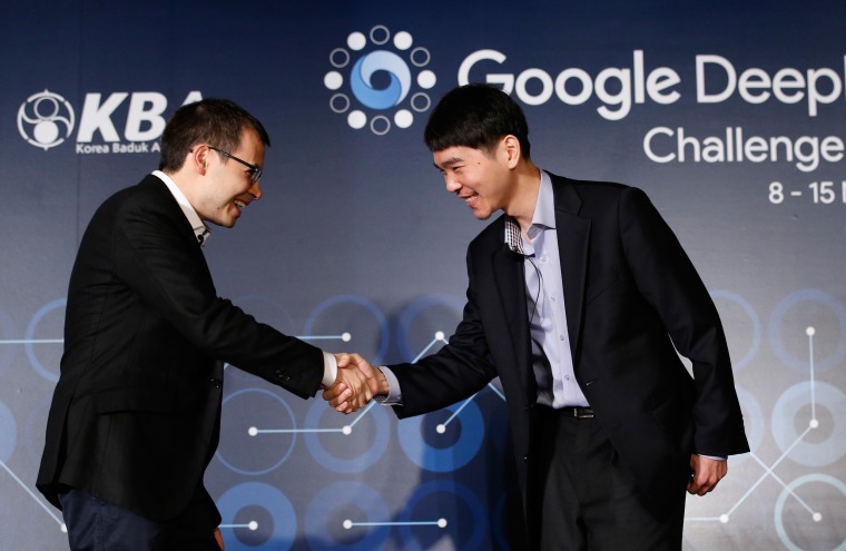 Image: South Korean professional Go player Lee Sedol, right, shakes hands with CEO of Google DeepMind Demis Hassabis