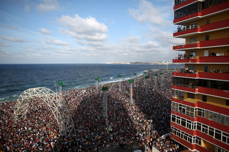 Image: People at the seafront Malecon watch a performance by U.S. electronic music group Major Lazer in Havana