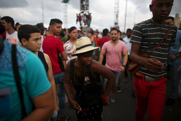 Image: Tattoo artist Javier Garcia, 25, dances during a performance by U.S. electronic music group Major Lazer in Havana