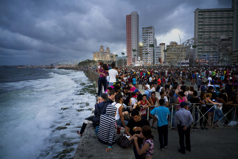 Image: Fans enjoy the afternoon at the Havana seafront after a free concert in Havana