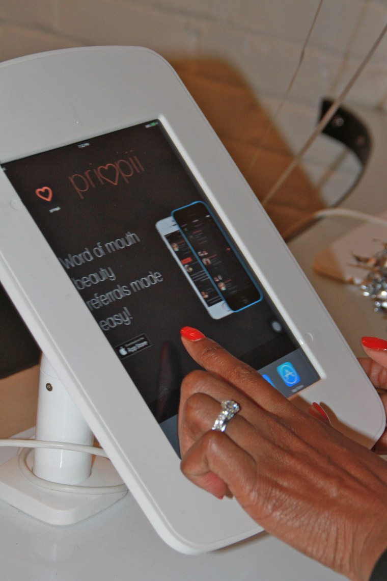 An iPad display of the beauty-sharing app, Primpii - founded by Tausha Robertson.