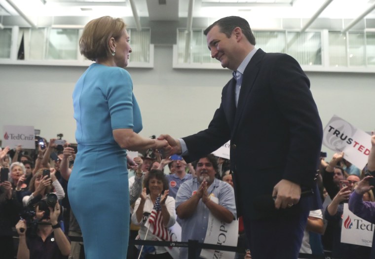 Image: Republican U.S. presidential candidate Cruz shakes hands with former Republican presidential candidate Fiorina at campaign rally in Miami