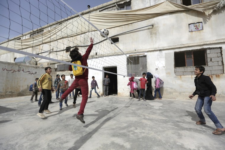 Image: Students play during their break at the Freedom School, in the town of al-Tamanah, in the southern countryside of Idlib