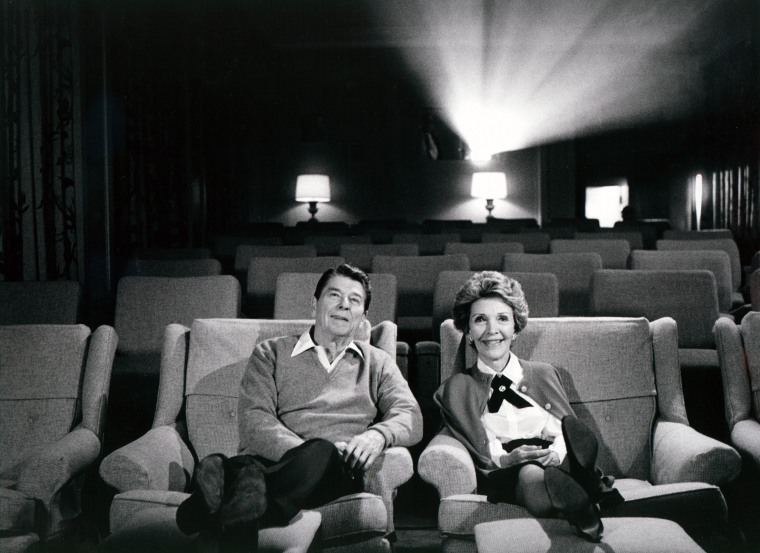The Reagans sit in a cozy 44 seat screening room at the White House.