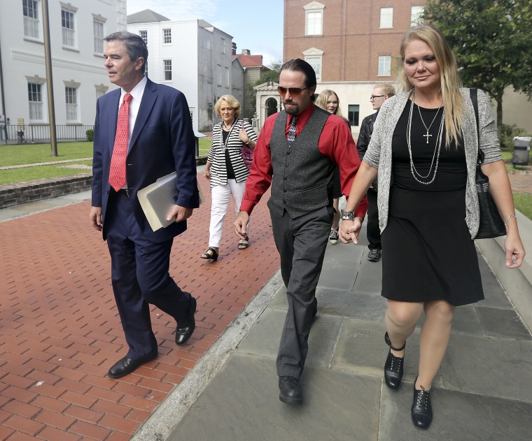 Sidney and Tammy Moorer leave the courthouse in Charleston, S.C.,  after a bond modification hearing on Thursday, Aug. 6, 2015. The couple is charged with the murder of Heather Elvis. She was reported missing on Dec. 19, 2013, after her car was found at Peachtree boat landing. Her body has not been found.  (Janet Blackmon Morgan/The Sun News via AP)