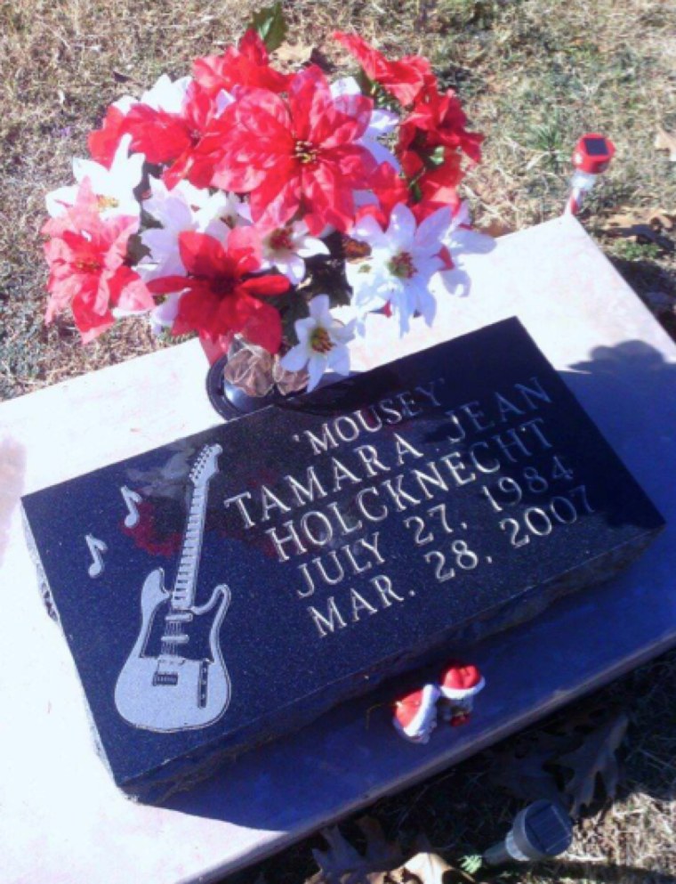 Tamara's gravestone includes her nickname "Mousey" as well as an image of a guitar.