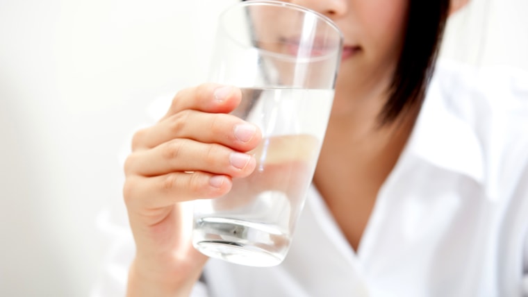 a beautiful woman drinking; Shutterstock ID 82192285; PO: today.com