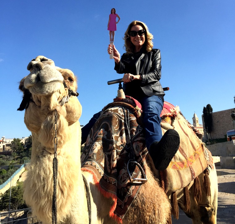 Kathie Lee, along with "flat Hoda," ride a camel on the Mount of Olives in Israel.