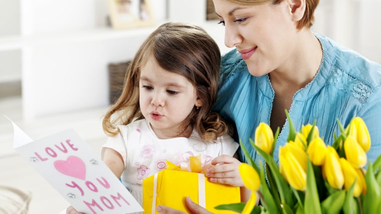 Mother receiving bunch of flowers from her daughter; Shutterstock ID 155708870; PO: today.com
