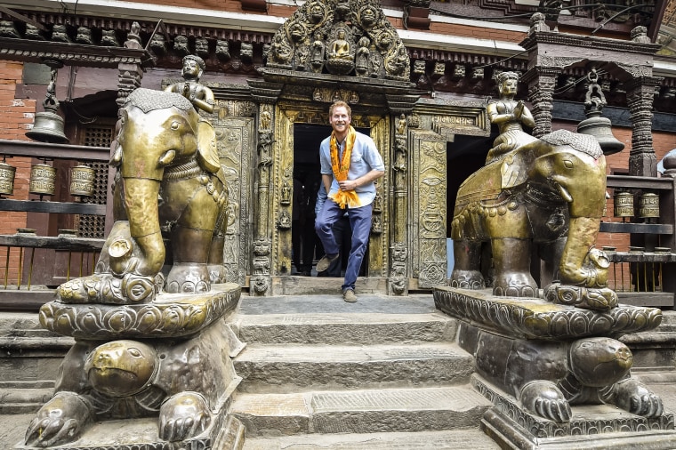 Prince Harry enters Hiranya Varna Mahavihar, know locally as the Golden Temple, during the second day of his tour of Nepal on March 20, 2016 in Kathmandu, Nepal.