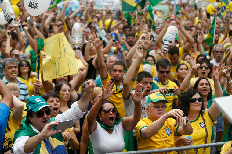 Image: Demonstrators gather during a protest