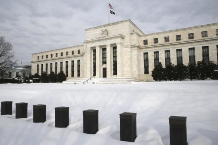 Snow covers the grounds of the U.S. Federal Reserve in Washington