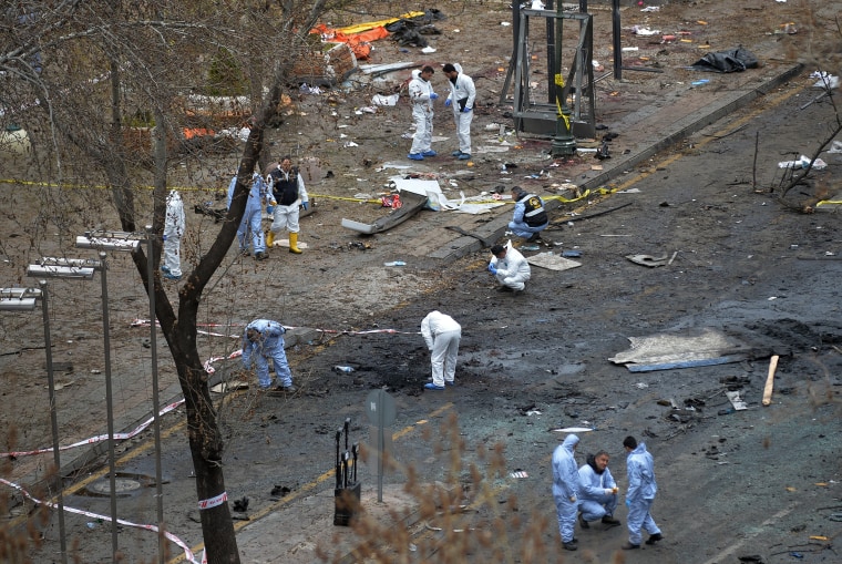 Image: Forensic officials work at the Sunday's explosion site in Ankara