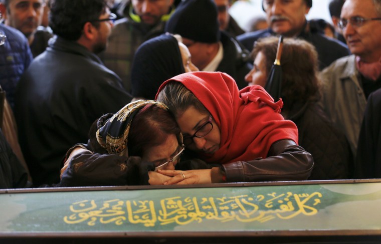 Image: Women mourn over the coffin of a car bombing victim during a commemoration ceremony in a mosque in Ankara