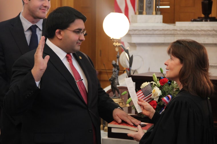 Niraj Antani, the first Indian American elected to Ohio's state legislature and a practicing Hindu, being sworn in.