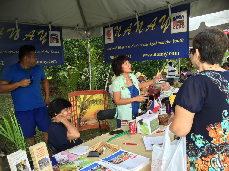 A voter registration and education booth hosted by NANAY at a cultural event.