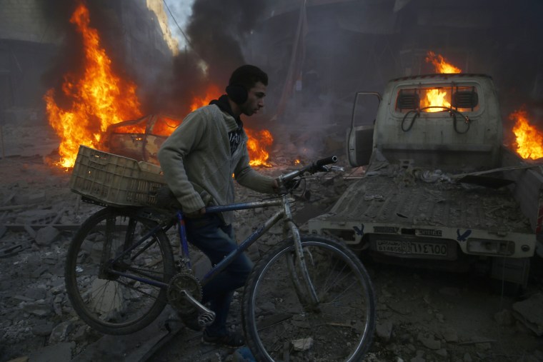 Image: The aftermath of airstrikes in Hamouria, Syria, on Dec. 9, 2015