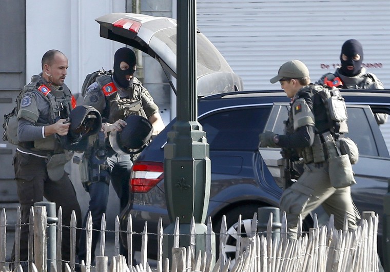 Image: Police at the scene where shots were fired during a police search of a house in the suburb of Forest near Brussels, Belgium, March 15, 2016.