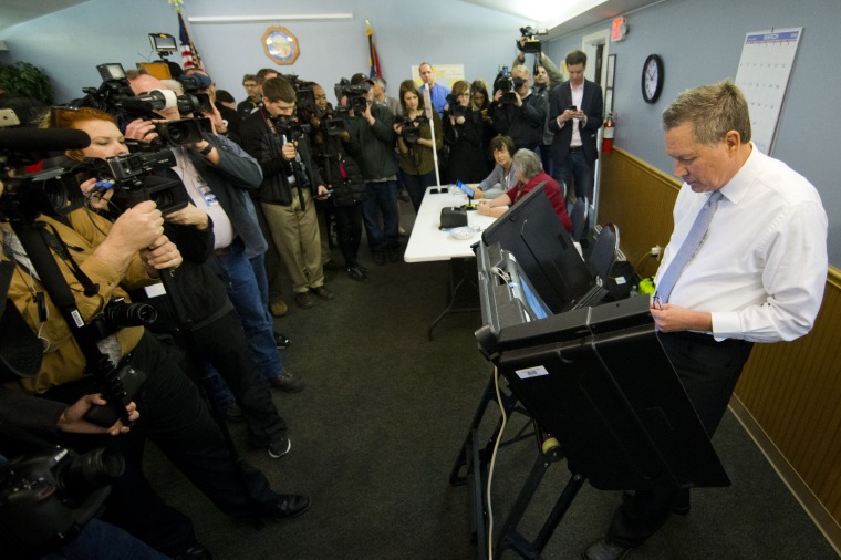 Image: Kasich casts his ballot in the primary election