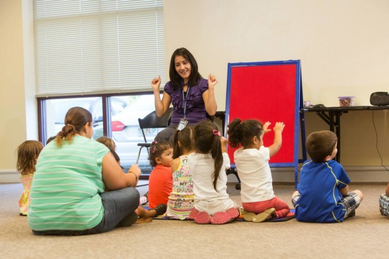 Librarian reading to students.