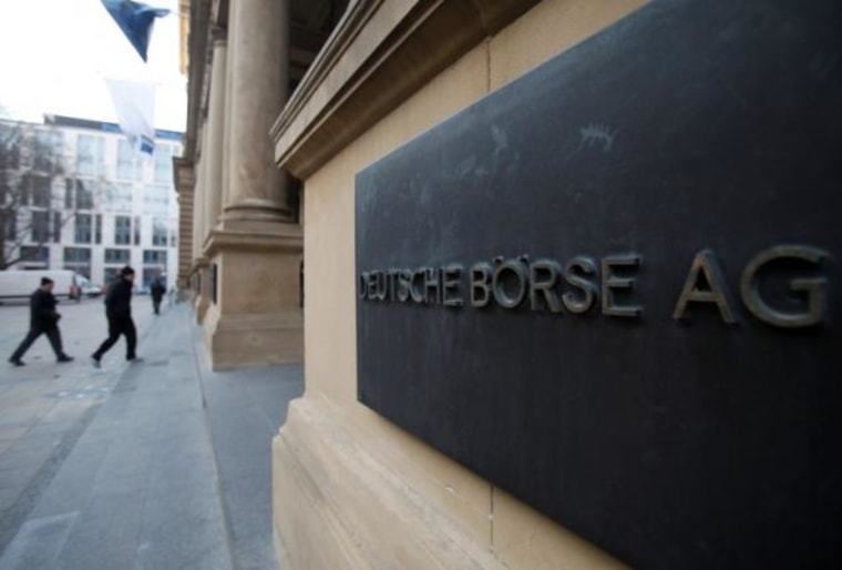 The plaque of the Deutsche Boerse AG is pictured at the entrance of the Frankfurt stock exchange