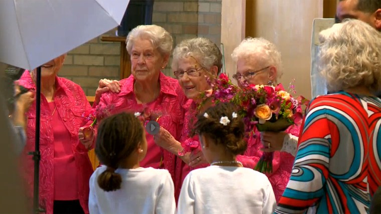 Elderly women serve as flowergirls at wedding