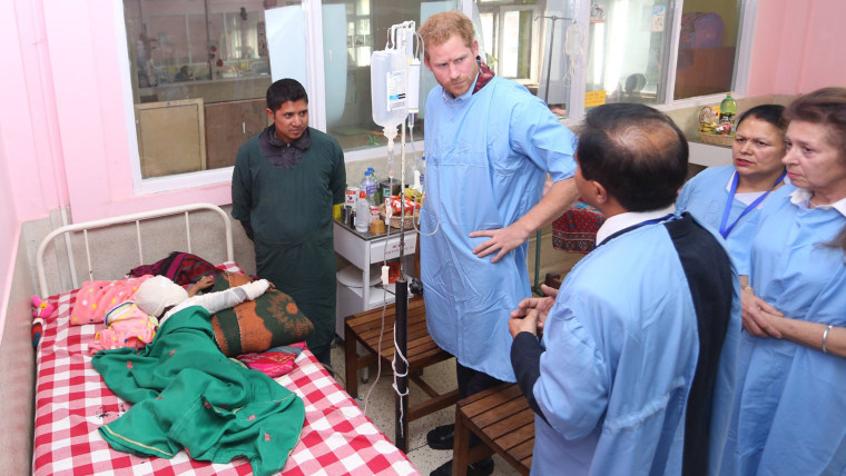 Image: Britain's Prince Harry visits a patient at the burn unit of Kanti Children's Hospital