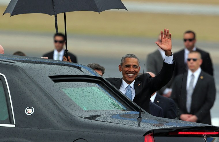 Image: President Obama waves after his arrival