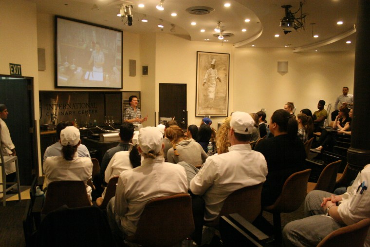 J. Kenji López-Alt hosting a cooking demonstration at the International Culinary Center.