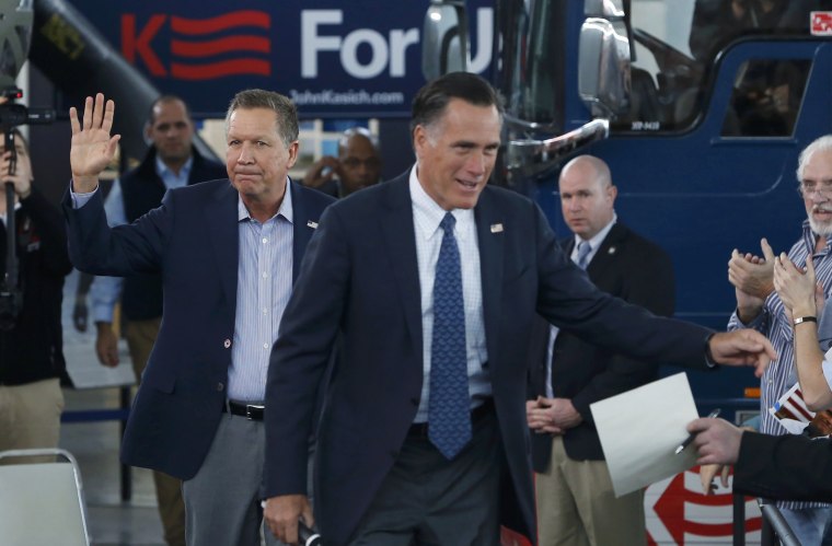 Image: U.S. Republican presidential candidate Kasich and former Republican presidential nominee Romney arrive at campaign rally in North Canton, Ohio