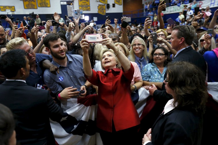 Image: Democratic U.S. presidential candidate Clinton takes a selfie with supporters at a campaign rally at Carl Hayden Community High School in Phoenix