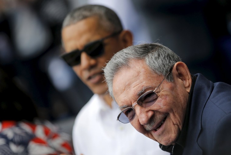 Image: U.S. President Barack Obama and Cuban President Raul Castro arrive to attend a baseball game at Estadio Latinoamericano in Havana