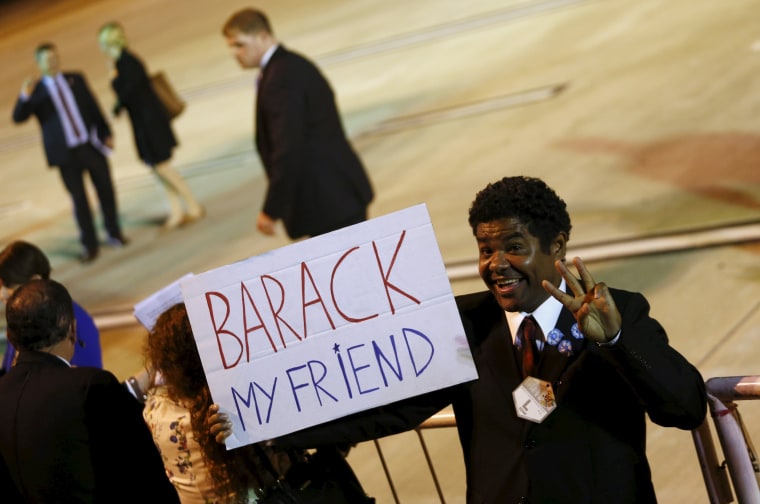 Image: A supporter of U.S. President Obama gestures for the cameras.