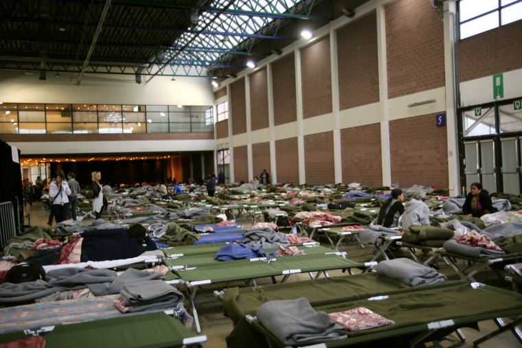 Image: makeshift shelter for passengers stranded by Brussels airport closure