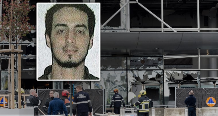 Image: Broken windows are seen at the terminal of Brussels national airport during a ceremony following bomb attacks in Brussels metro and at the airport in Zaventem, Belgium